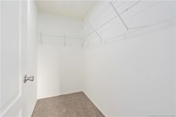 a view of a balcony with lake view and a floor to ceiling window