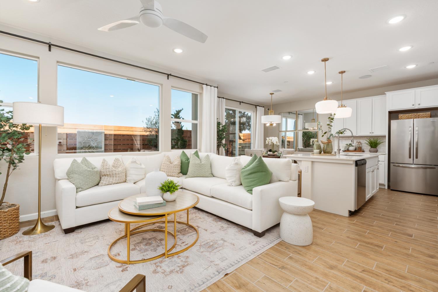 1490 Redbrick Lane Clovis, CA 93619 - Photo 4 of 34 a living room with furniture kitchen view and a refrigerator
