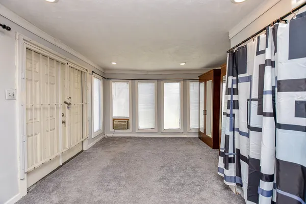 a view of livingroom with hardwood floor and windows