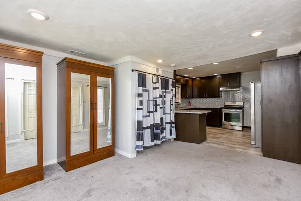 a kitchen with a refrigerator and a sink