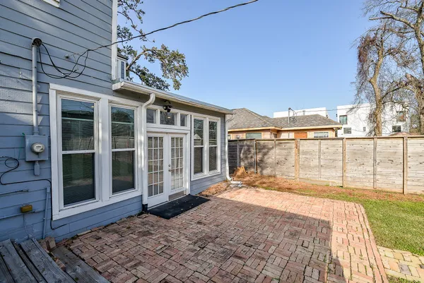 a front view of a house with a yard table and chairs