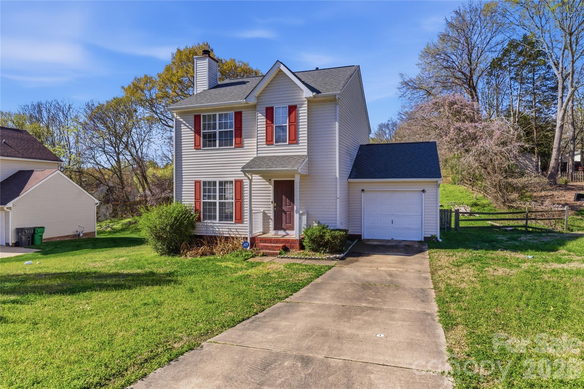 8608 Moody Road Charlotte, NC 28215 - Photo 1 of 33 a front view of a house with a yard