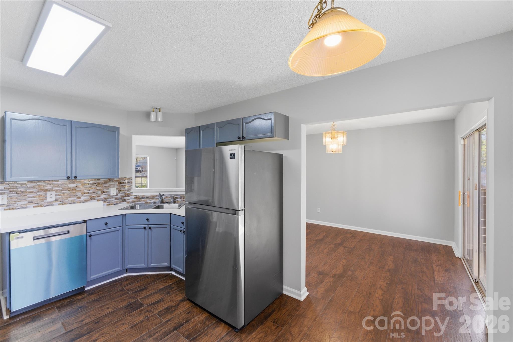 8608 Moody Road Charlotte, NC 28215 - Photo 16 of 33 a kitchen with stainless steel appliances granite countertop a refrigerator and a stove