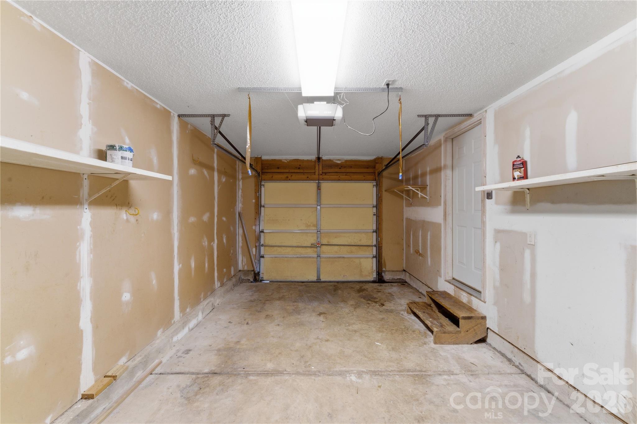 8608 Moody Road Charlotte, NC 28215 - Photo 28 of 33 a view of room that has a garage