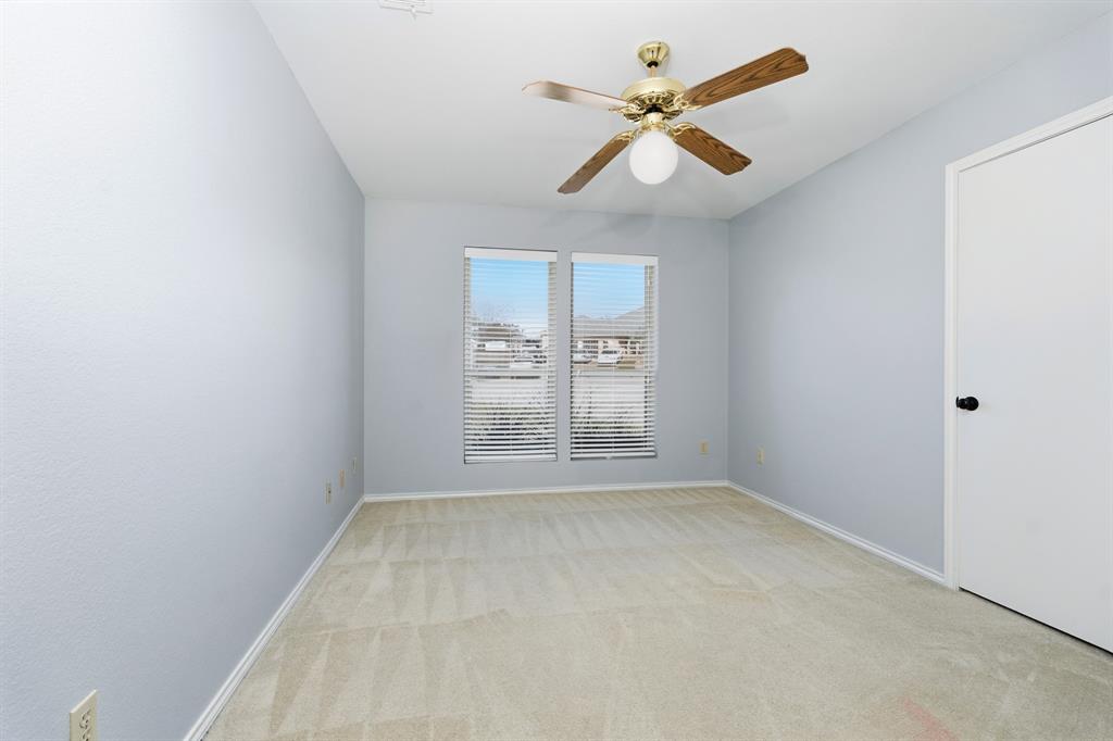 7205 Windcrest Court East North Richland Hills, TX 76182 - Photo 15 of 35 wooden floor in an empty room with a window