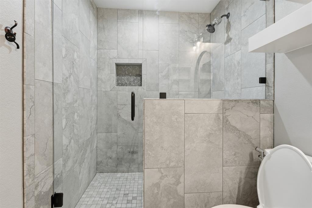 7205 Windcrest Court East North Richland Hills, TX 76182 - Photo 20 of 35 a bathroom with a shower