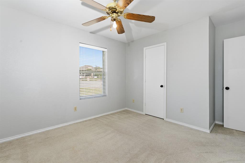 7205 Windcrest Court East North Richland Hills, TX 76182 - Photo 21 of 35 a view of an empty room with a window