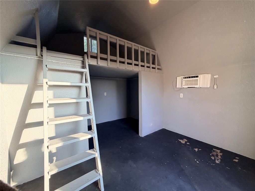 7205 Windcrest Court East North Richland Hills, TX 76182 - Photo 27 of 35 a view of staircase with white walls and a window