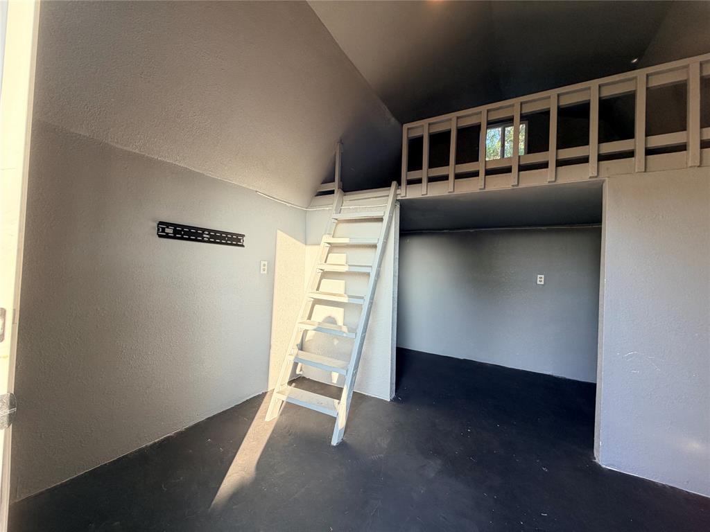 7205 Windcrest Court East North Richland Hills, TX 76182 - Photo 30 of 35 a view of empty room with wooden floor and windows