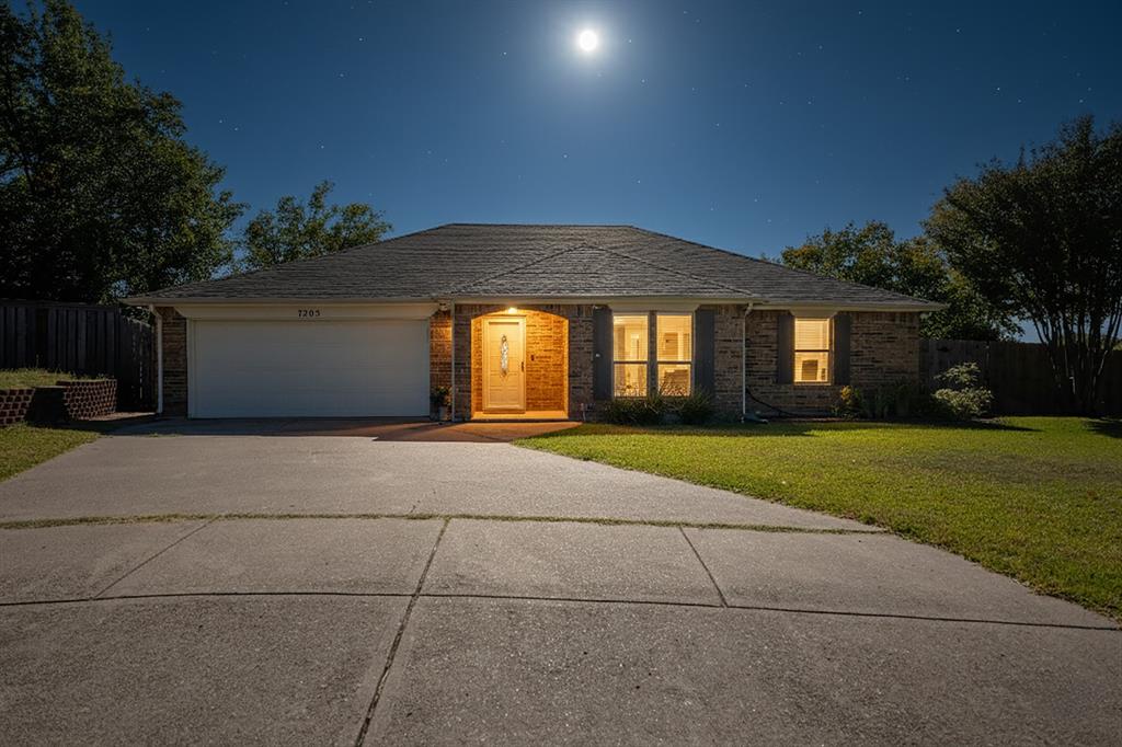 7205 Windcrest Court East North Richland Hills, TX 76182 - Photo 31 of 35 a front view of house with yard and green space