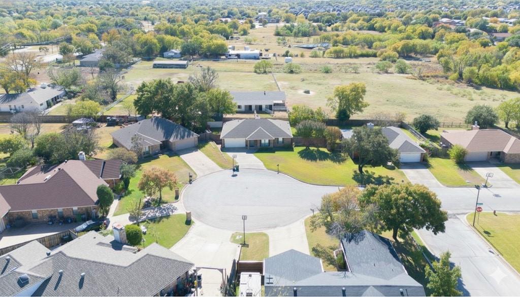 7205 Windcrest Court East North Richland Hills, TX 76182 - Photo 35 of 35 an aerial view of residential houses with outdoor space