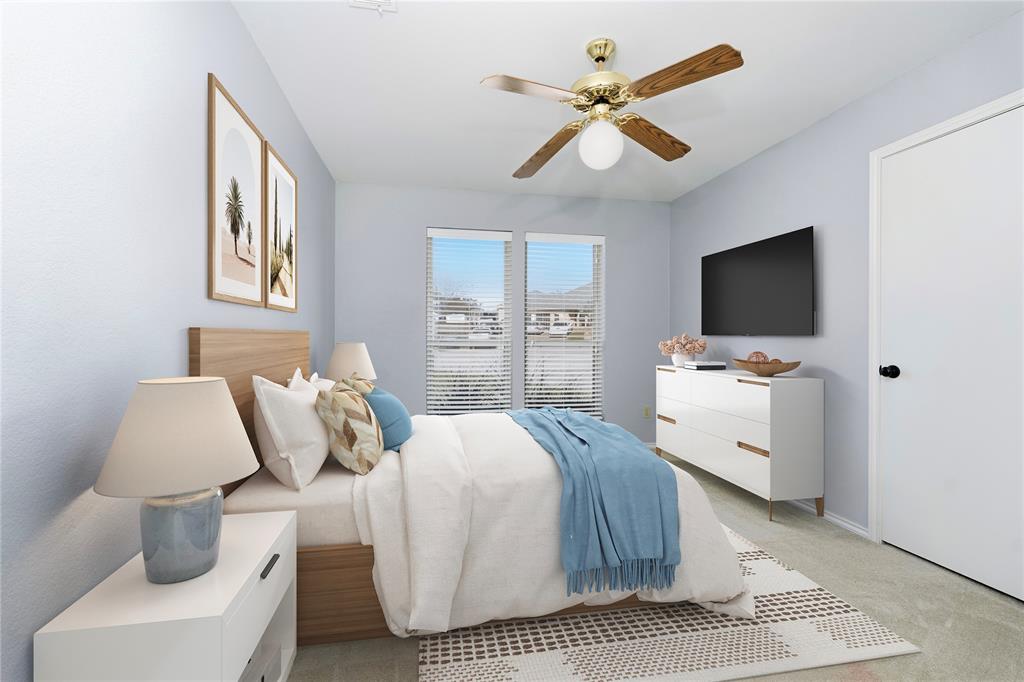 7205 Windcrest Court East North Richland Hills, TX 76182 - Photo 5 of 35 a bedroom with a bed and a flat screen tv