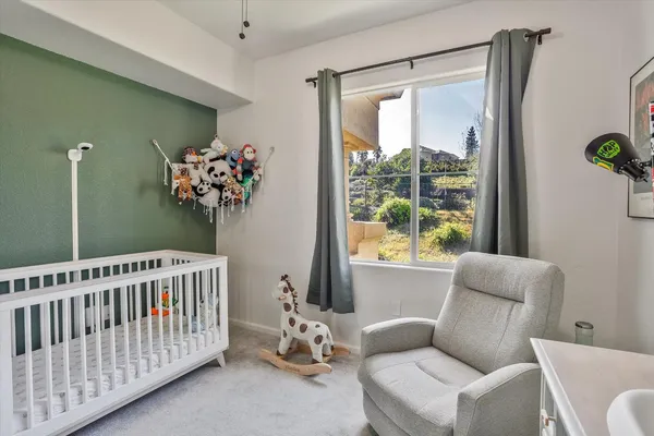 a bedroom with furniture and a window
