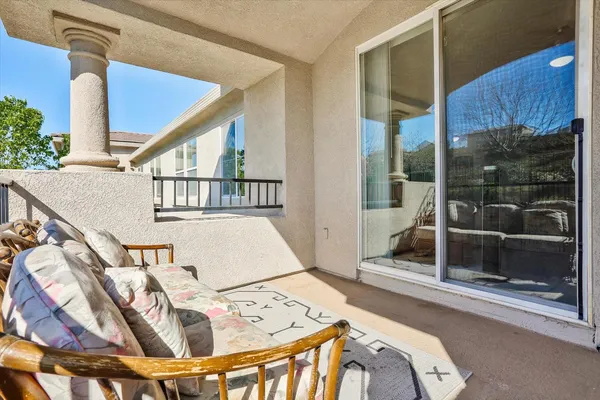 a view of balcony with furniture