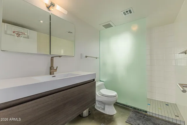 a kitchen with stainless steel appliances a refrigerator and a stove top oven