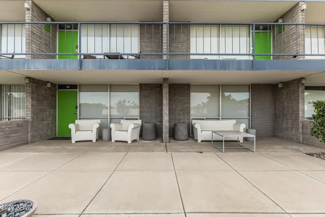 a view of a patio with couches and potted plants