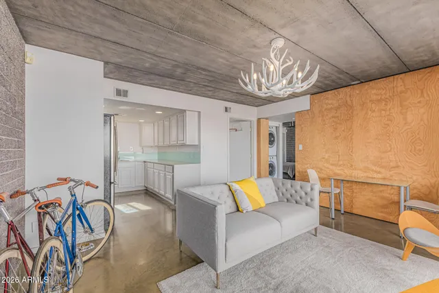 a view of a livingroom with furniture and a window