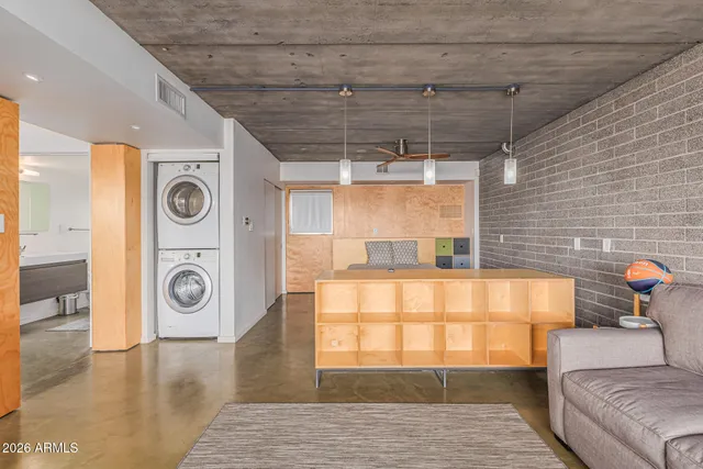 a living room with furniture and a window