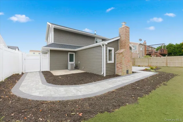 a view of a house with a yard and garage