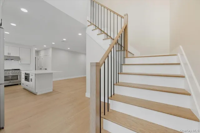 a view of kitchen with wooden floor and electronic appliances