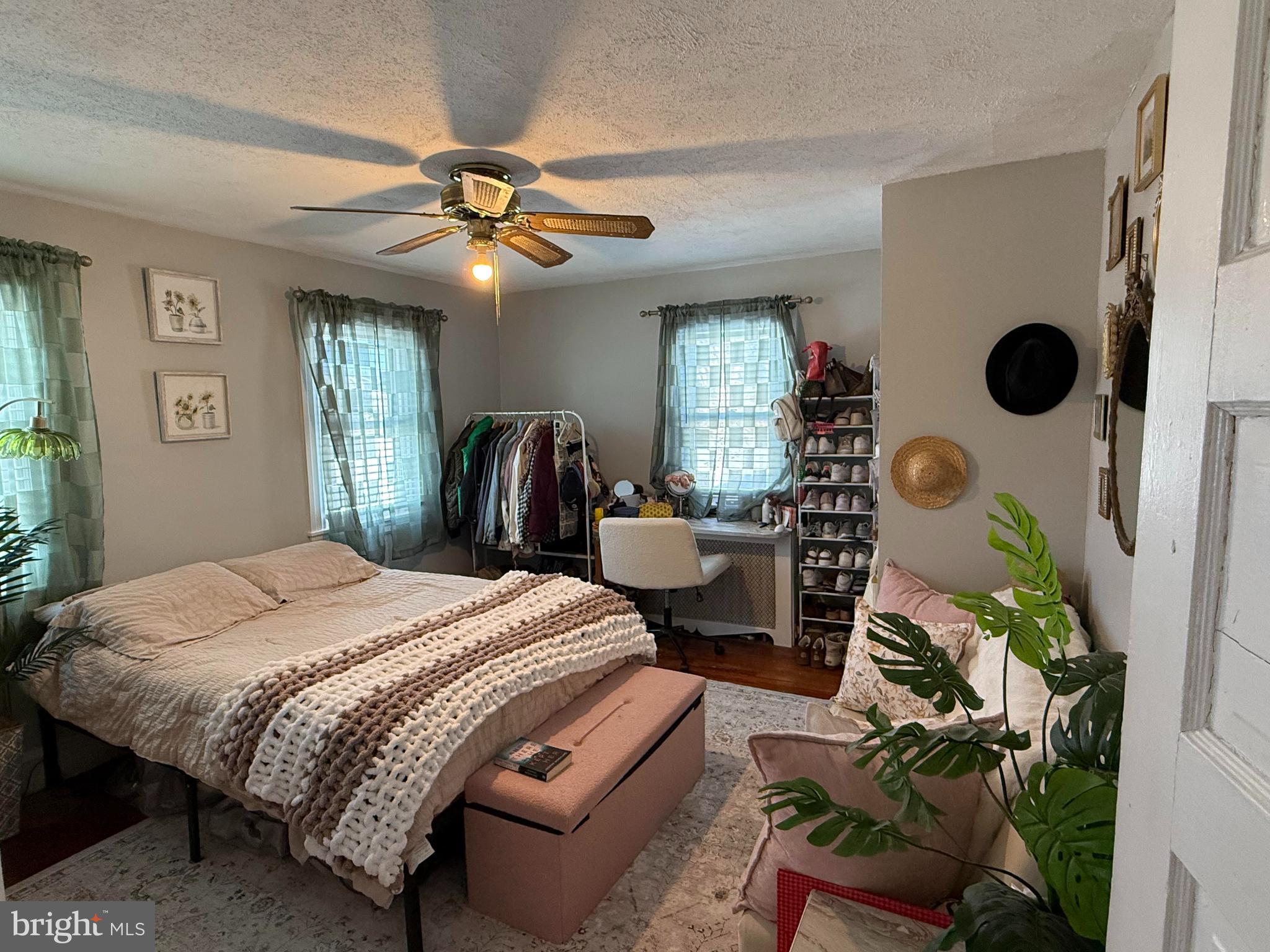 530 Kenmore Road Havertown, PA 19083 - Photo 14 of 25 a bed room with a bed and a chandelier