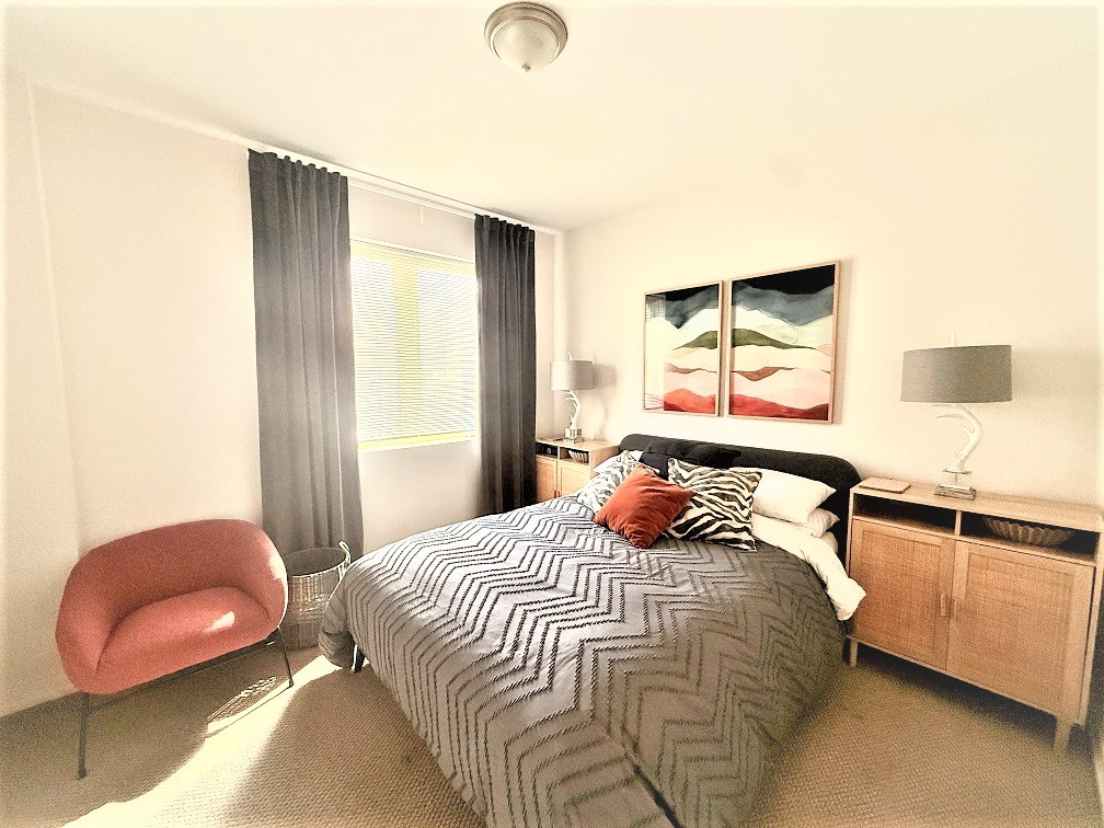 2835 West Division Street, Unit 1W Chicago, IL 60622 - Photo 14 of 39 a bedroom with a bed and attached with a large mirror