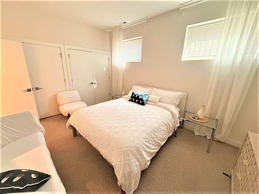 2835 West Division Street, Unit 1W Chicago, IL 60622 - Photo 28 of 39 a bed room with a bed and a couch