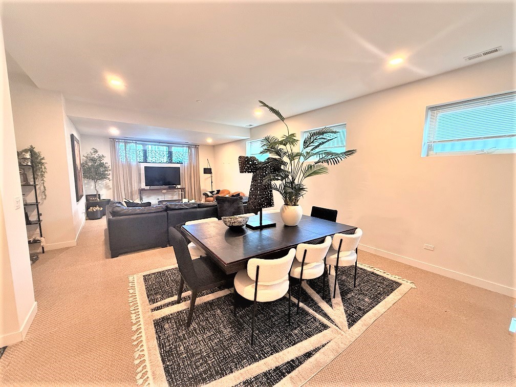 2835 West Division Street, Unit 1W Chicago, IL 60622 - Photo 33 of 39 a dining room with furniture and wooden floor