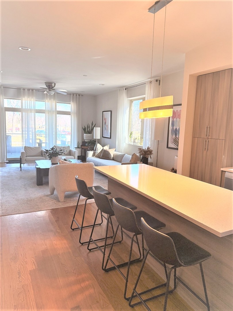 2835 West Division Street, Unit 1W Chicago, IL 60622 - Photo 4 of 39 a living room with a table and chairs