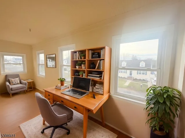 a living room with furniture a rug and a large window