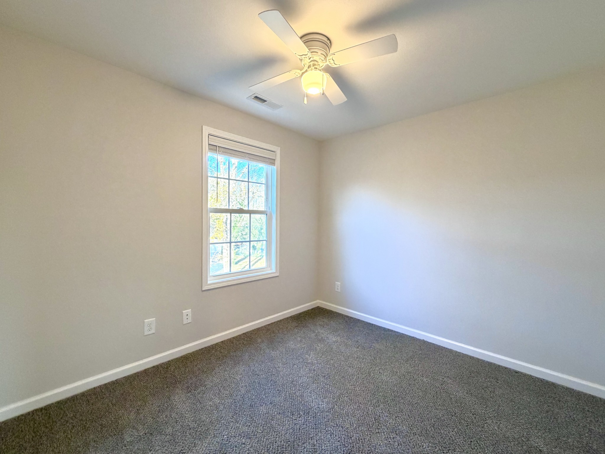 509 Britton Springs Road, Unit B4 Clarksville, TN 37042 - Photo 16 of 20 an empty room with a window and a fan
