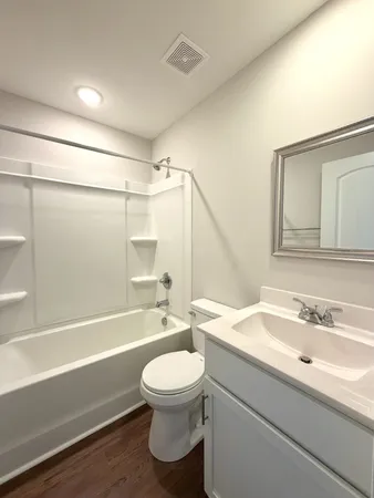 a bathroom with a sink a toilet and a bathtub