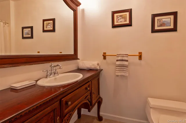 a hallway with wooden floor and stairs