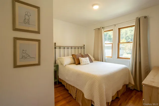 a bedroom with furniture and a book shelf