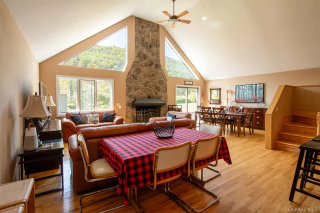 a kitchen with stainless steel appliances granite countertop a refrigerator a stove and a wooden cabinets