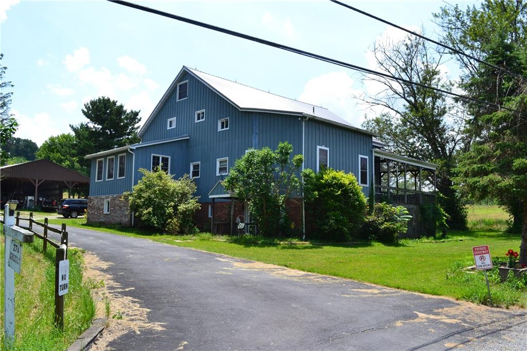 274 Gressly Road Ruffs Dale, PA 15679 - Photo 1 of 49 a house view with a garden space
