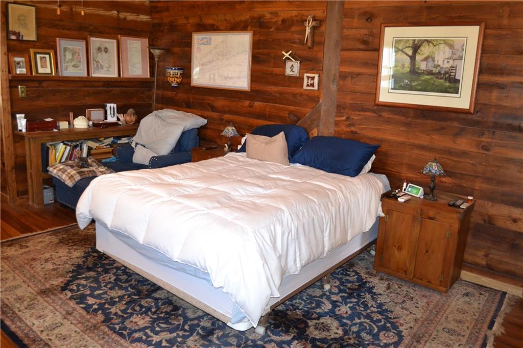 274 Gressly Road Ruffs Dale, PA 15679 - Photo 17 of 49 a large bed sitting in a bedroom next to a lamp