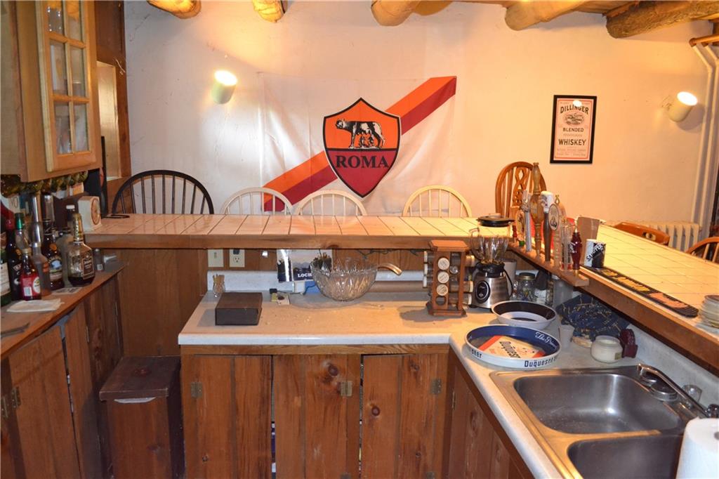 274 Gressly Road Ruffs Dale, PA 15679 - Photo 27 of 49 a kitchen with a sink and a stove top oven