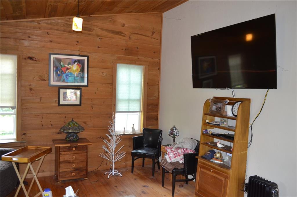 274 Gressly Road Ruffs Dale, PA 15679 - Photo 33 of 49 a living room with furniture and a flat screen tv
