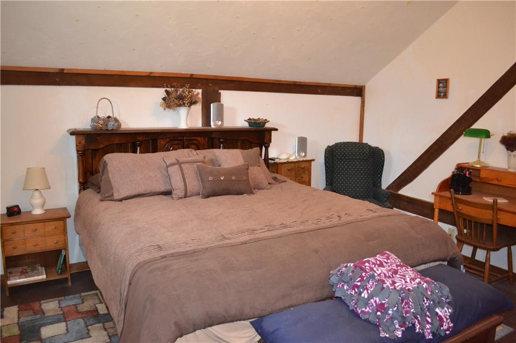 274 Gressly Road Ruffs Dale, PA 15679 - Photo 34 of 49 a bedroom with a bed and a potted plant