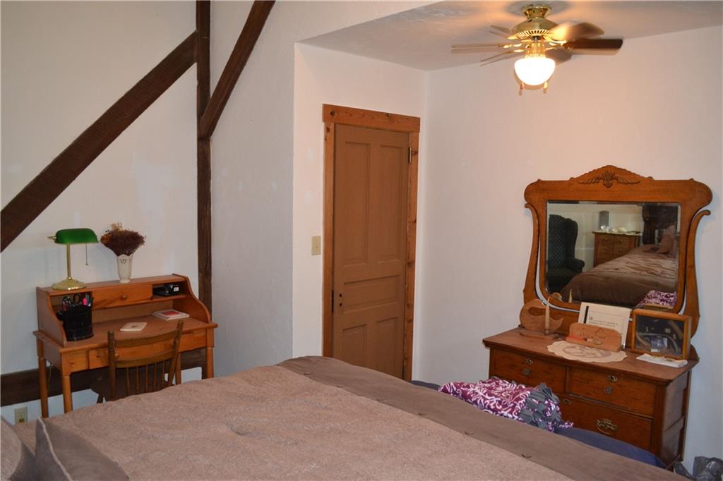 274 Gressly Road Ruffs Dale, PA 15679 - Photo 35 of 49 a bedroom with a bed and a chandelier