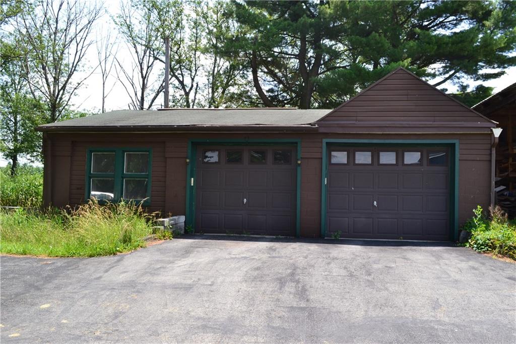 274 Gressly Road Ruffs Dale, PA 15679 - Photo 6 of 49 a front view of a house with a yard and garage