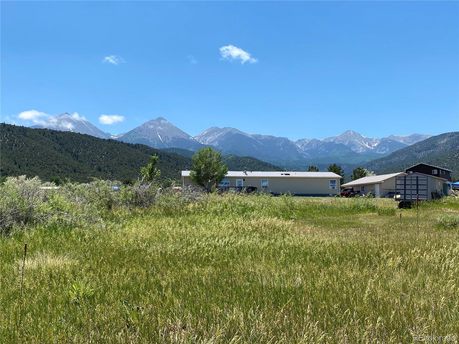 3255 Ranch Road Hartsel, CO 80449 - Photo 14 of 22 a view of a house with a yard and a large tree
