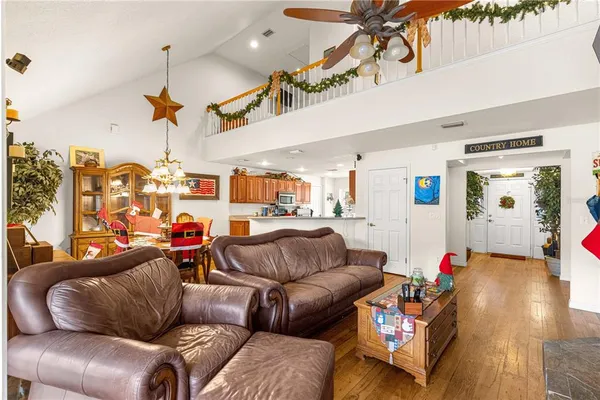 a view of kitchen with stainless steel appliances granite countertop sink stove and cabinets