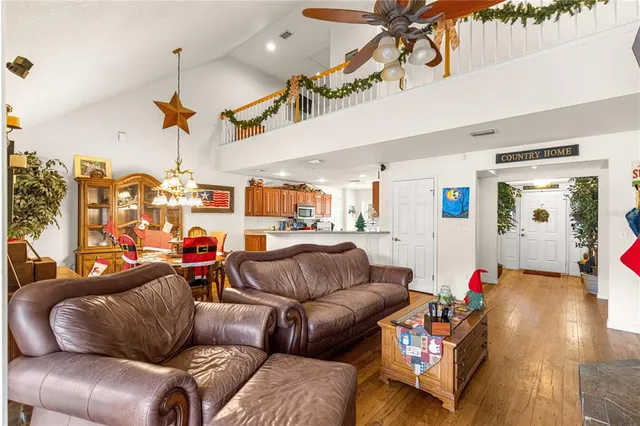 a view of kitchen with stainless steel appliances granite countertop sink stove and cabinets
