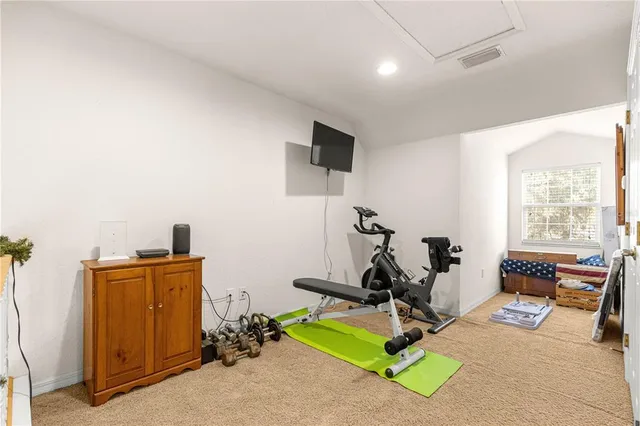 a bathroom with a double vanity sink a mirror and a bathtub