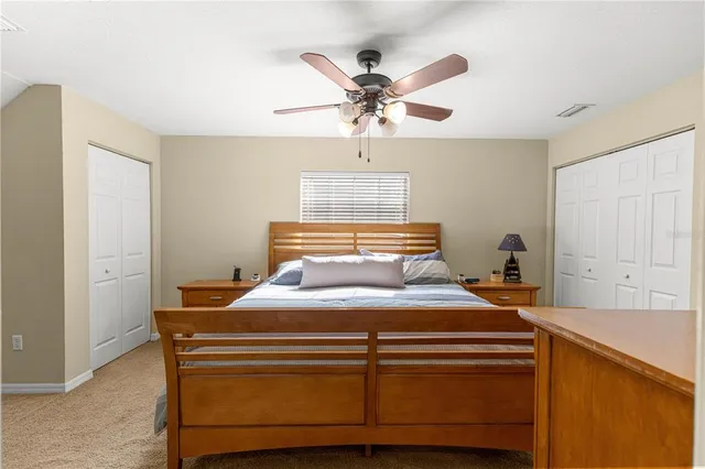 a view of a patio with table and chairs under an umbrella