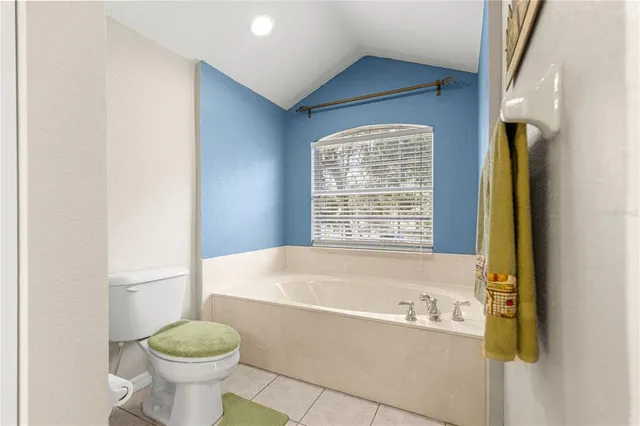 a view of a swimming pool with a sitting area