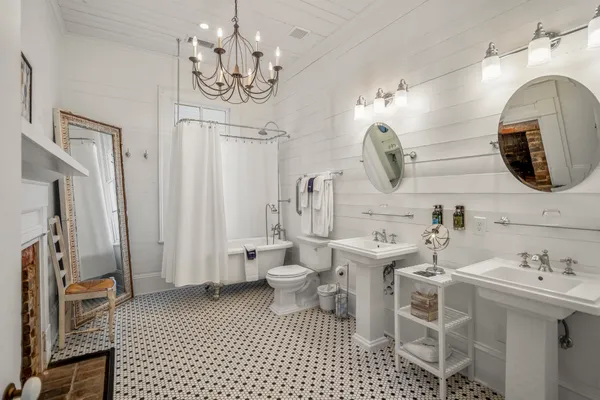 a bathroom with a sink a mirror and a shower