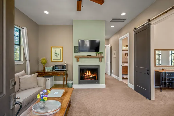 a living room with furniture and a fireplace